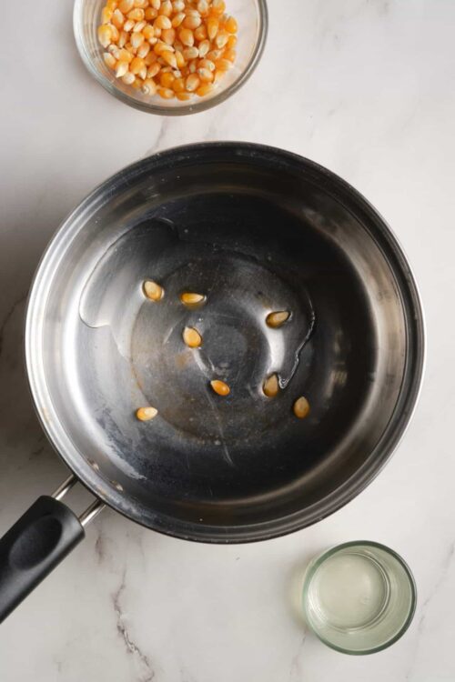 Roasted corn kernels in a skillet for a delicious baked recipe.