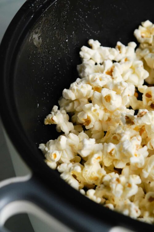 Buttered popcorn in an air fryer for movie night.