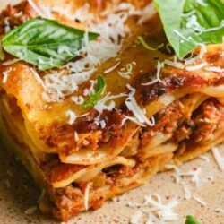 Savory baked lasagna with cheese and fresh basil.