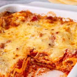 Crispy baked lasagna with melted cheese and rich tomato sauce.