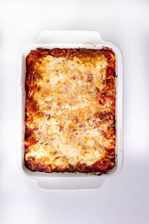 Cheesy baked casserole with melted cheese and tomato sauce, ready to serve.