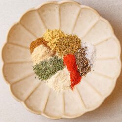 Spice ingredients in a decorative bowl for baking or cooking.