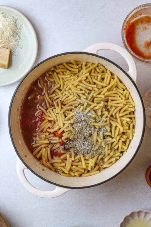 Creamy baked ziti pasta with cheese, tomato sauce, and herbs.