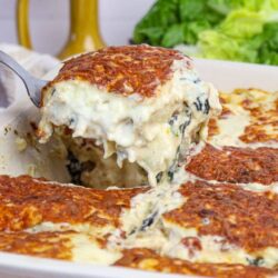 Creamy spinach and mushroom stuffed chicken casserole baked with cheese.