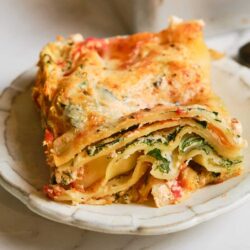 Creamy vegetable lasagna with layers of cheese, spinach, and tender pasta in a golden baked crust.