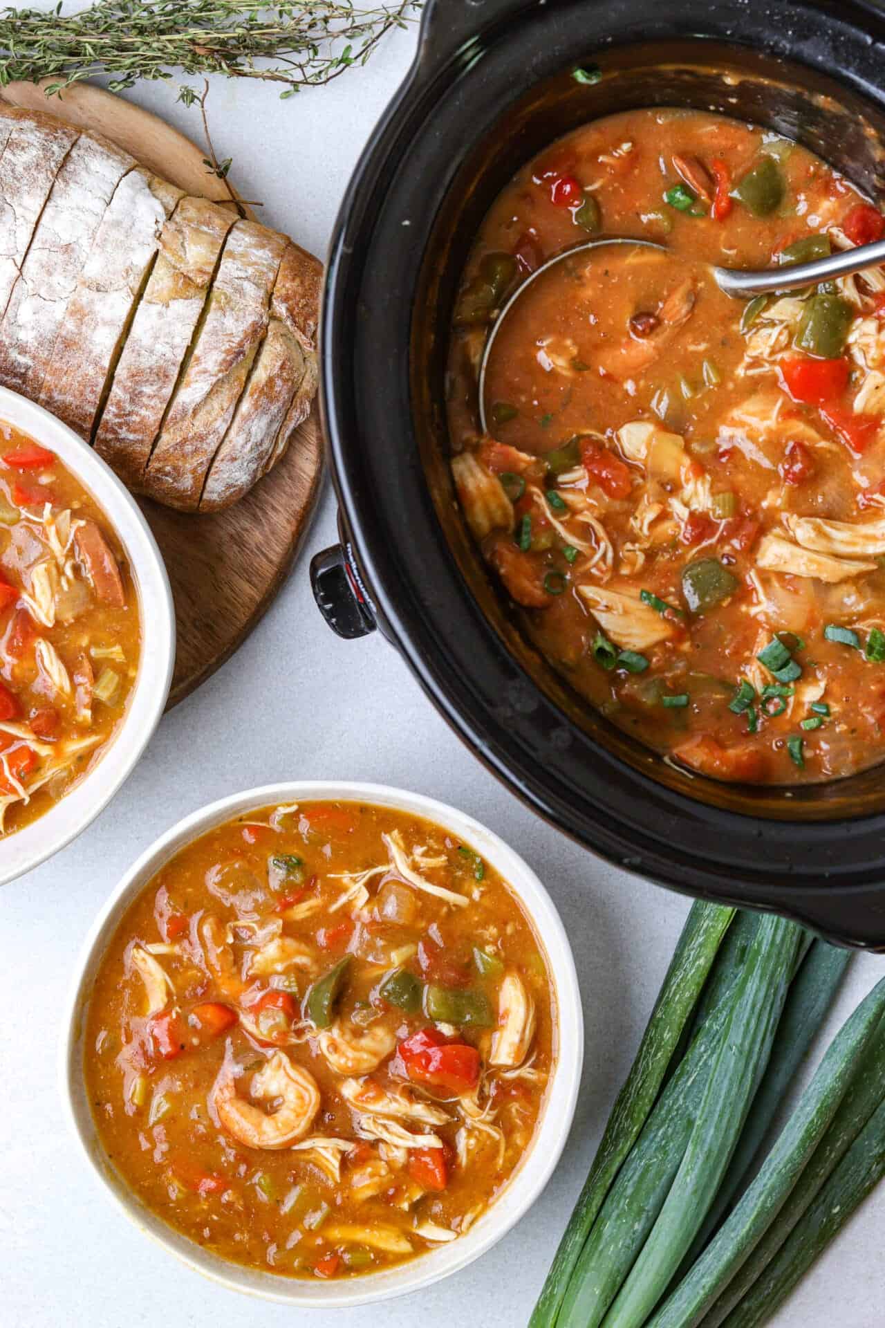 Creamy slow cooker chicken and vegetable soup with tender chicken, fresh vegetables, and herbs in a savory broth.