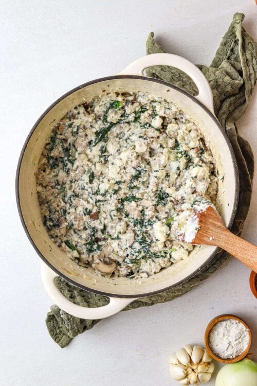 Creamy chicken and mushroom stuffing casserole with spinach and herbs.