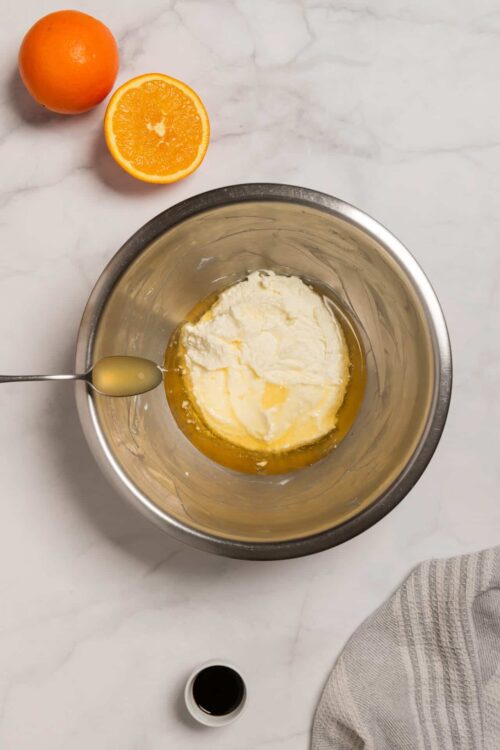 Cream cheese and butter mixture for baking on marble countertop.