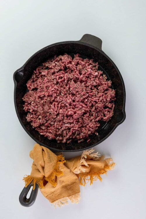 Ground beef cooking in a skillet for easy recipes.