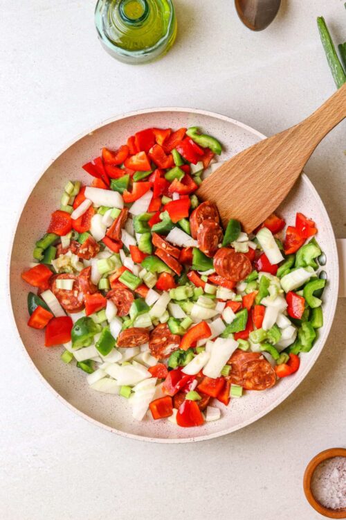 Chopped vegetables in a ceramic bowl for cooking or baking.