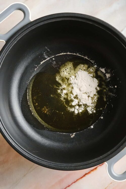 Butter melting and flour in a non-stick skillet for baking or cooking process.