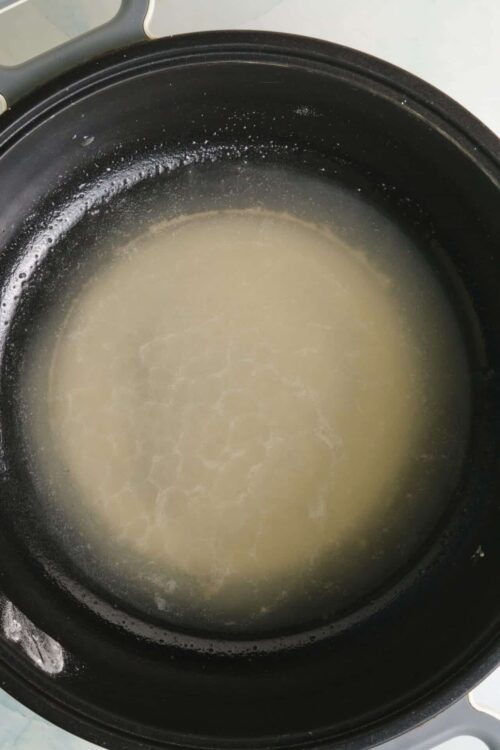 Creamy melted butter in a black Instant Pot for cooking or baking.