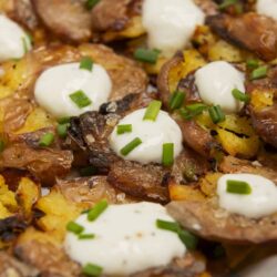 Crispy hash brown breakfast casserole with sour cream and green onions.