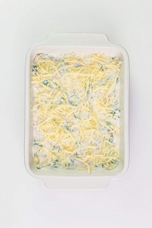 Creamy vegetable casserole with shredded cheese and herbs.