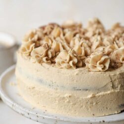 Buttercream cake with toasted coconut and chocolate shavings.