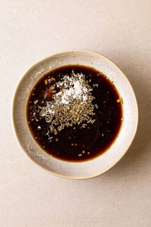 Soy sauce with garlic, ginger, and pepper for Asian-inspired marinades or dipping sauces.