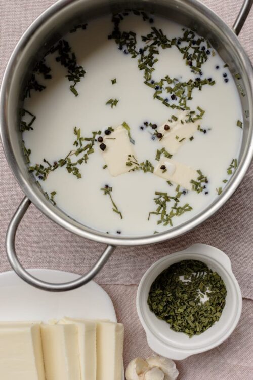 Creamy Milk Infused with Fresh Herbs and Black Peppercorns for Cooking or Hot Beverages.