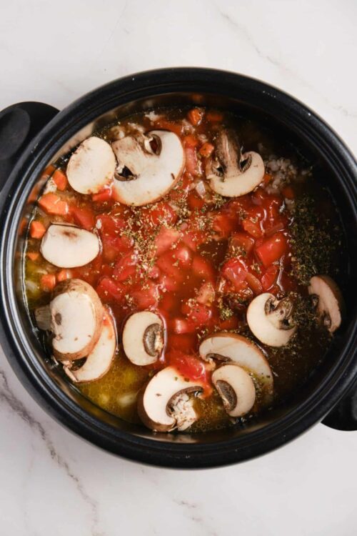 Sautéed mushroom and tomato mixture in slow cooker, healthy vegetarian meal.