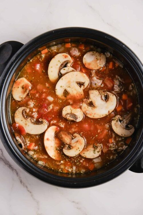 Hearty mushroom and vegetable stew in a slow cooker. Perfect comforting meal for chilly days.