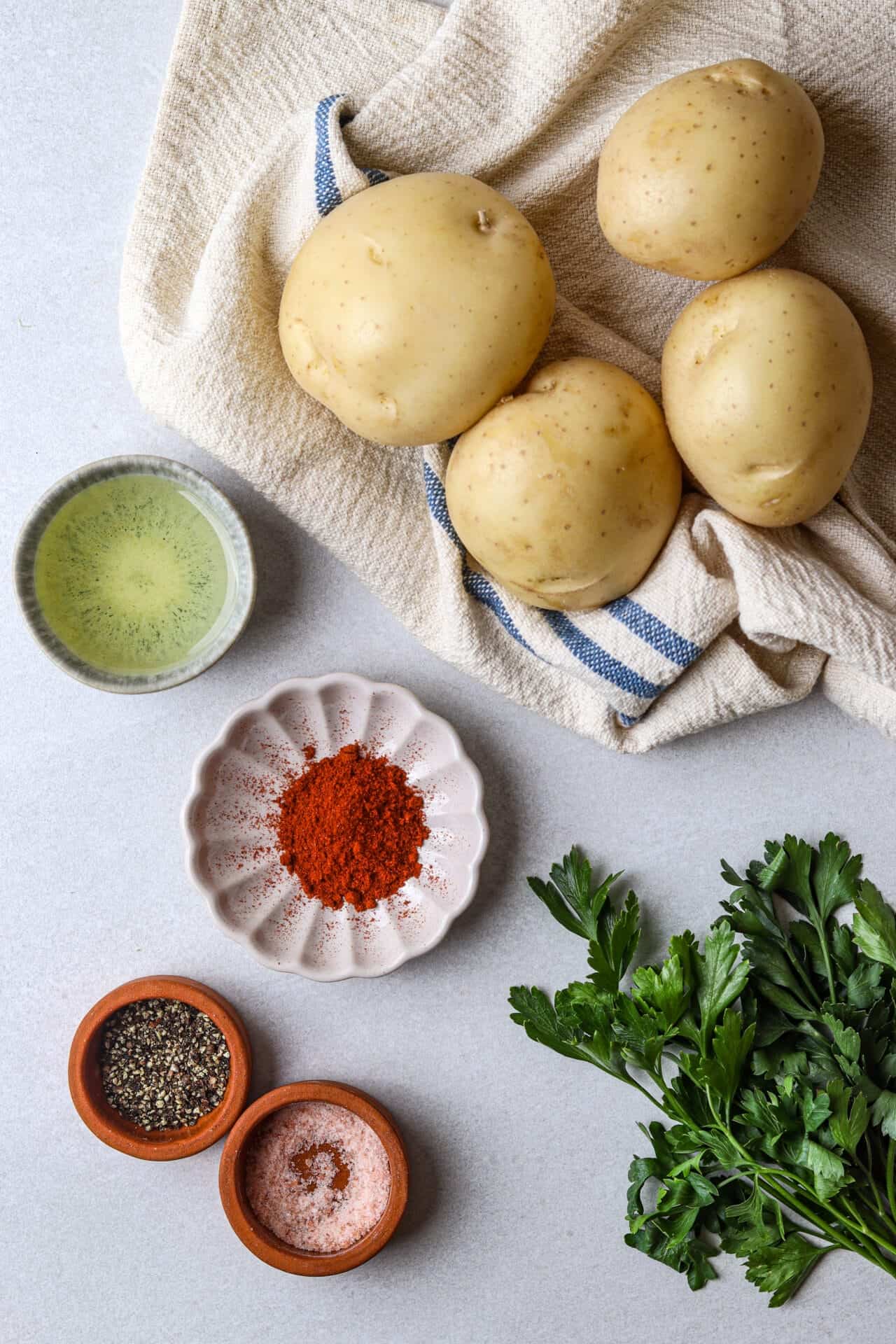 Fresh potatoes and herbs for baking.