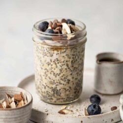 Creamy chia seed pudding topped with fresh blueberries and almond slices, perfect for a healthy breakfast or snack.