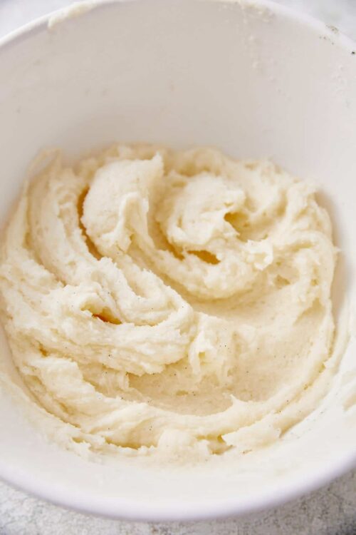 Creamy vanilla ice cream in a white bowl, ready to serve or freeze for dessert.