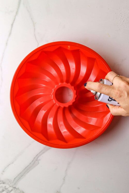 Bright red bundt cake pan for baking desserts.