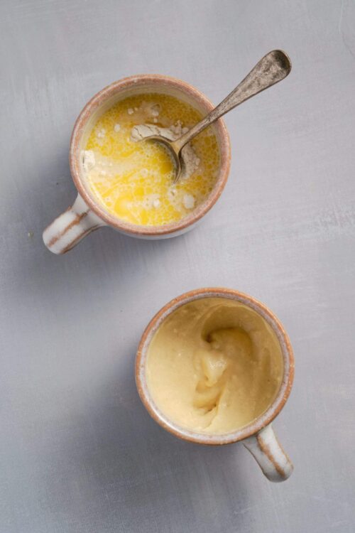 Flour and butter in ceramic mugs, ingredients for baking or cooking.