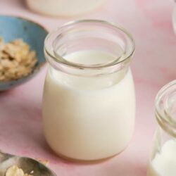 Cream in a glass jar, homemade milk, dairy product, healthy beverage, dairy nutrition.