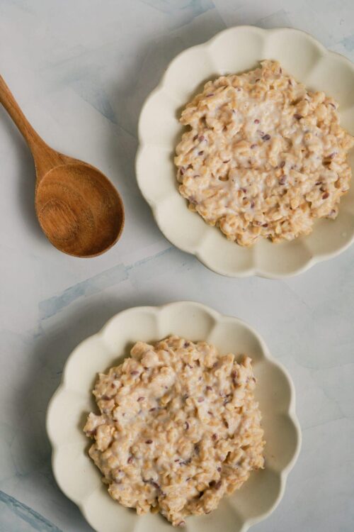 Creamy homemade tuna salad with relish in scalloped bowls.
