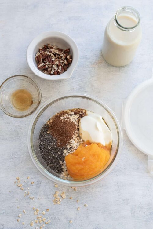 Cream cheese pumpkin bread ingredients in a glass mixing bowl.
