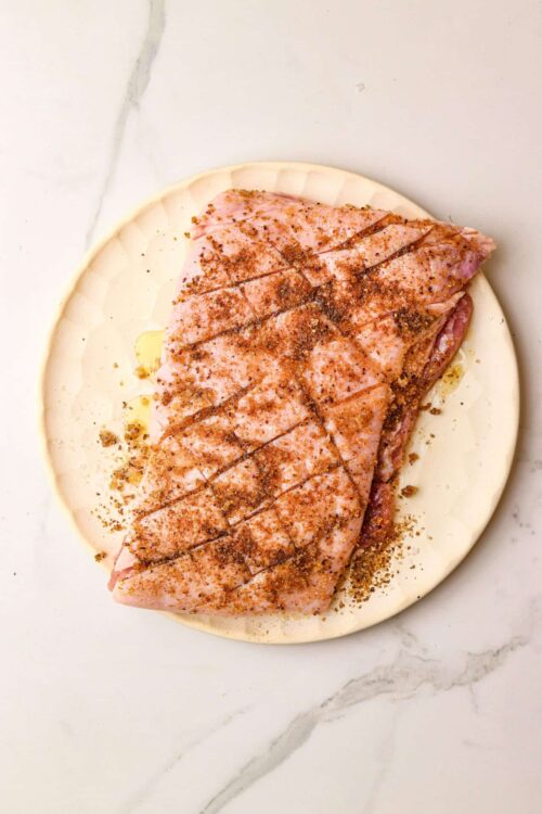 Seasoned raw salmon fillet on pie crust ready for baking, close-up culinary preparation, fresh seafood for healthy cooking.