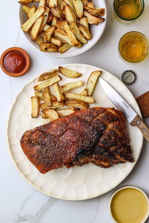 Crispy potato wedges with barbecue ribs and dipping sauces, baked to perfection.