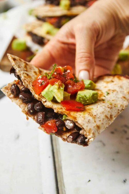 Black bean and avocado veggie wrap, healthy lunch idea with fresh ingredients, easy to make.