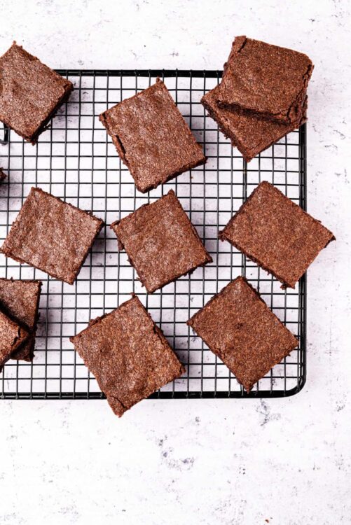 Rich chocolate brownies cooling on a wire rack, homemade dessert recipe, baked goods for chocolate lovers.