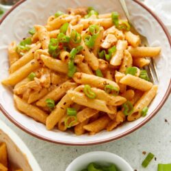 Creamy one-pot chicken and pasta with green onions, perfect easy dinner recipe from Baked Bree.