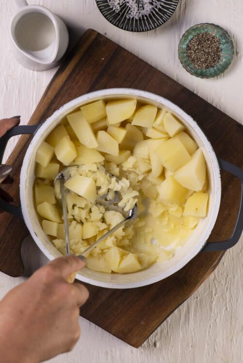 Potato peeling and prepping for baked potato recipe at home.