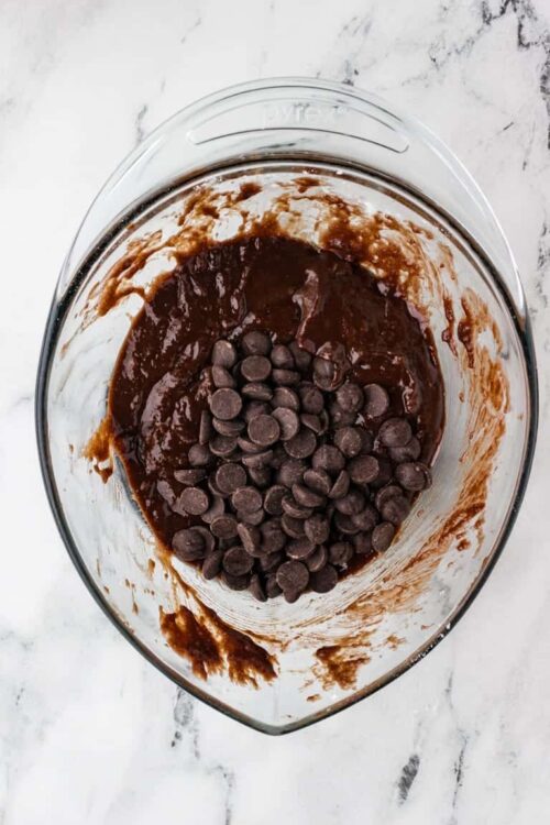 Rich chocolate melting in a mixing bowl for baking recipes.