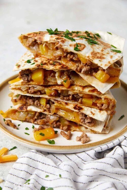 Savory beef and vegetable quesadillas on a plate, bakedbree style.