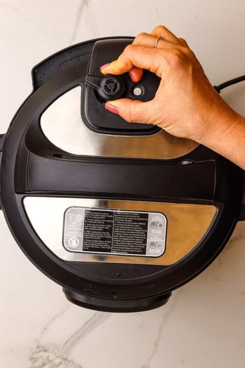 Air fryer control panel being adjusted, modern kitchen appliance, kitchen gadget, air frying, cooking equipment.