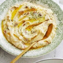 Creamy garlic mashed potatoes with herbs and butter. Perfect side dish for comforting home-cooked meals.