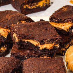Rich chocolate brownie squares with melted peanut butter filling, baked to perfection.