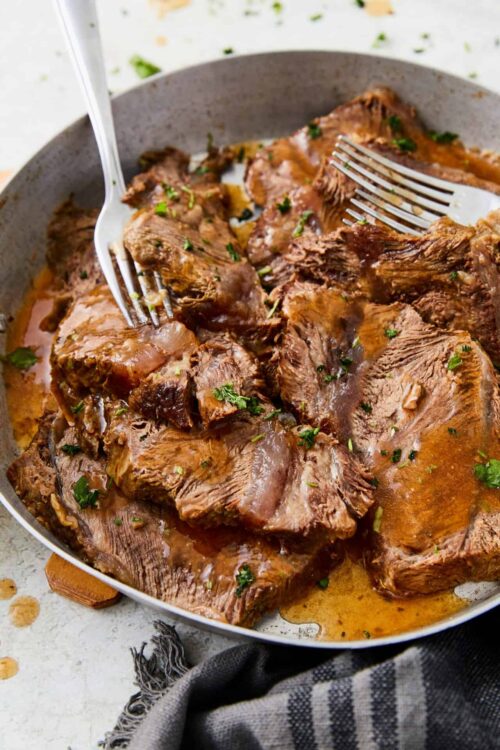 Slow cooker pot roast with tender beef and savory gravy, perfect for easy dinner recipes and comfort food.