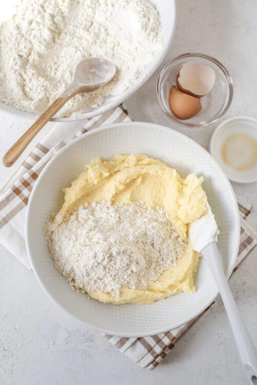 Flour, butter, eggs, and baking ingredients for homemade baked goods.