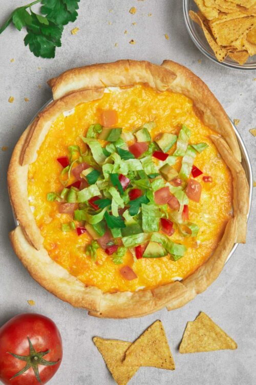 Baked cheese pizza with fresh vegetables and crispy crust.