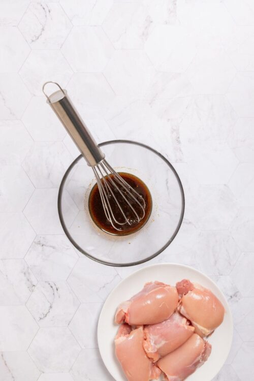 Soy sauce and chicken thighs for baking or cooking recipes.