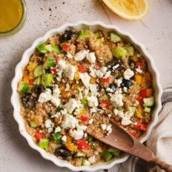 Savory quinoa and vegetable casserole with feta cheese and black olives.