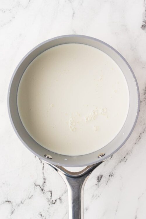 Creamy milk in a saucepan for baking or cooking.