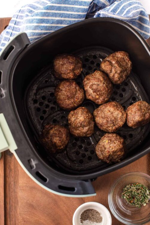 Juicy homemade meatballs cooked in an air fryer for perfect crispy texture. Easy recipe from Baked Bree.