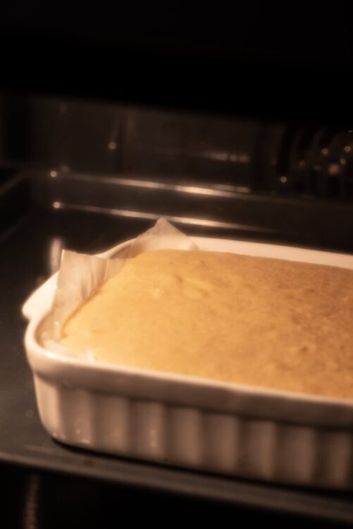 Steamed cornbread baking in the oven, golden and fluffy, ready to enjoy with butter or honey.